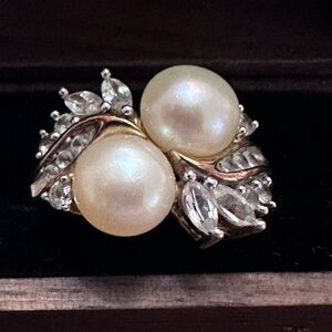 Dazzling twin pearls with shimmering diamond-like stones ladies’ ring.